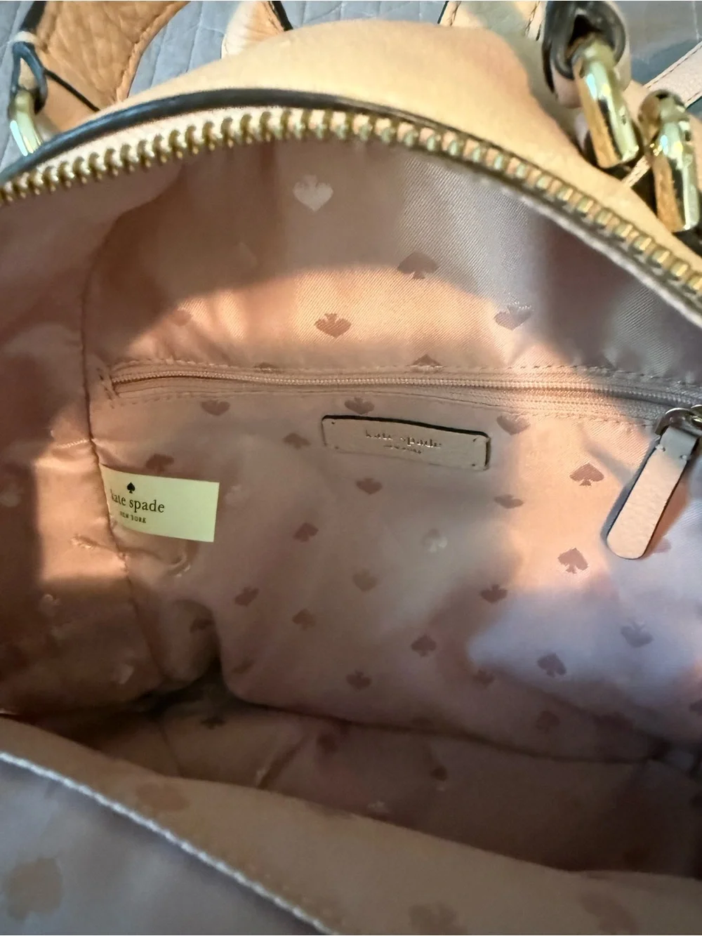 kate spade pebble leather mini backpack in blush beige